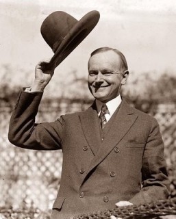 calvin-coolidge-tipping-his-hat-257x320.jpg